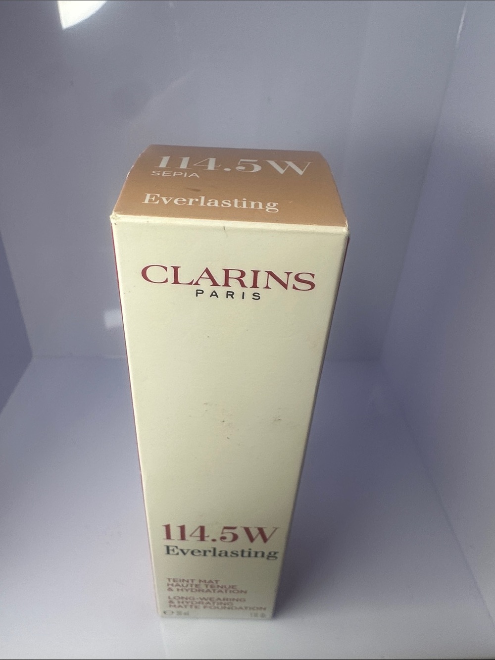 Clarins Everlasting Foundation 114.5W Sepia - Cream & Gold Accents